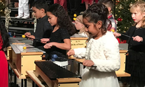 children playing xylophones 